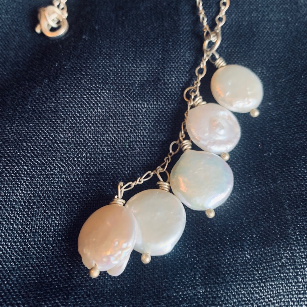 Pearl necklace and earrings.